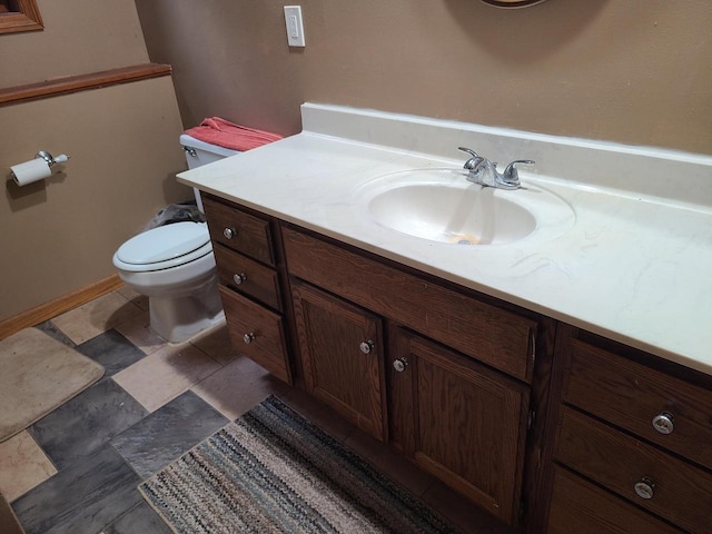 half bath with toilet and vanity