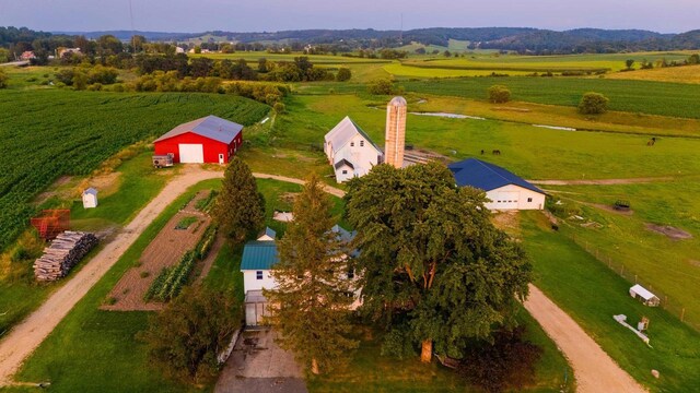 aerial view at dusk featuring a rural view