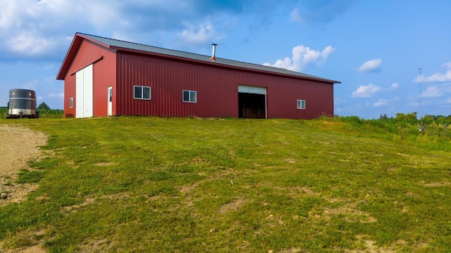 exterior space with a yard and an outbuilding