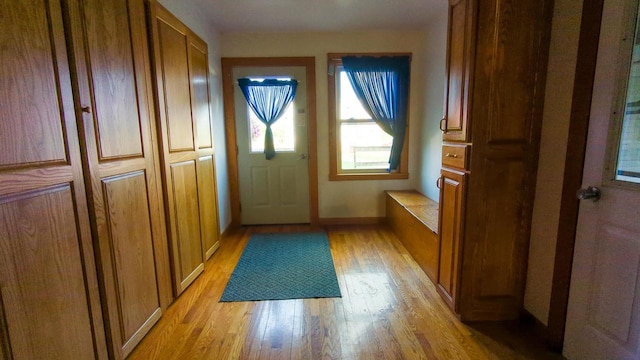 doorway with light wood-type flooring