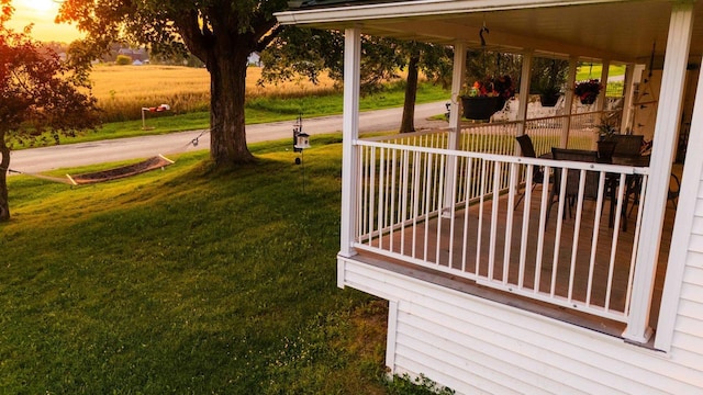 yard at dusk with covered porch