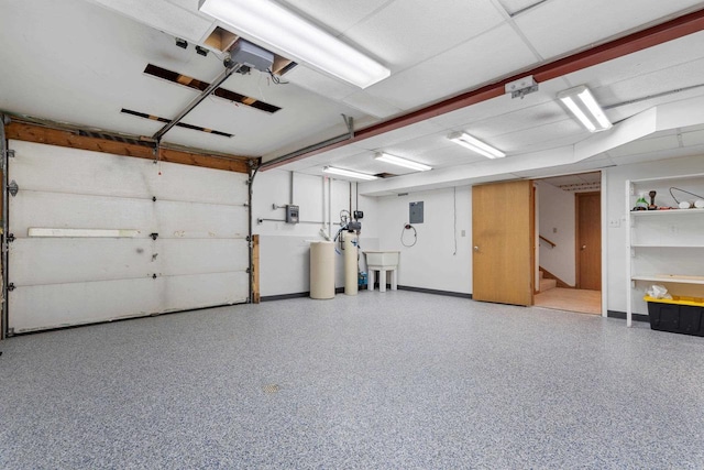 garage with sink and electric panel