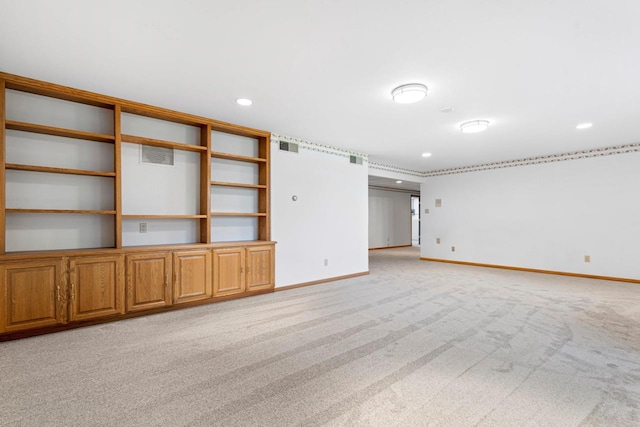 unfurnished living room with light carpet