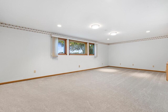 living room with ornamental molding, a tiled fireplace, and wood-type flooring