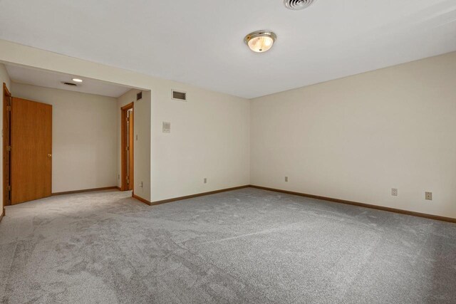 carpeted living room with crown molding and a premium fireplace