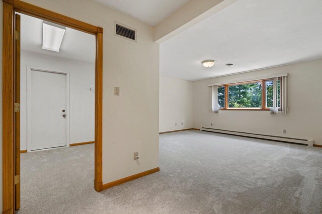 bathroom with vanity and a baseboard heating unit