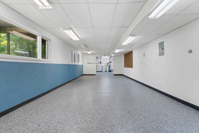 hallway featuring a baseboard heating unit and light hardwood / wood-style floors