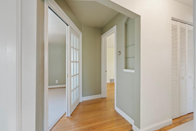 corridor featuring light hardwood / wood-style flooring