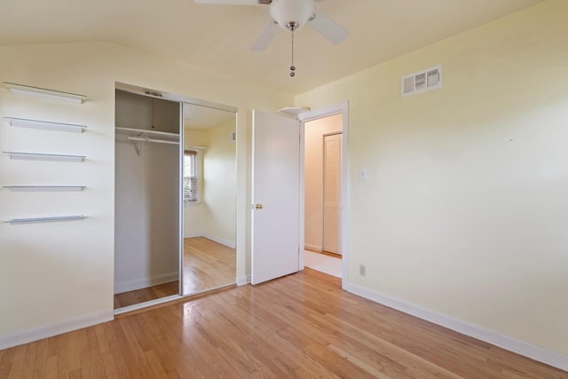 unfurnished bedroom with ceiling fan, a closet, and light hardwood / wood-style flooring