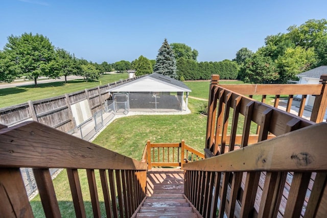 wooden terrace with a lawn