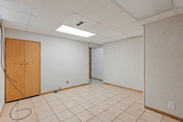 basement featuring a paneled ceiling