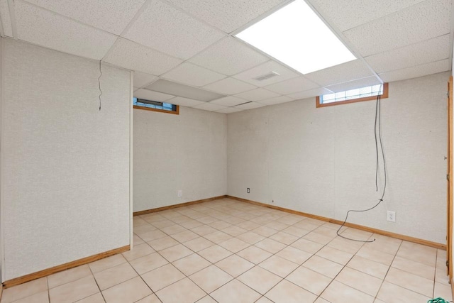 basement featuring a drop ceiling