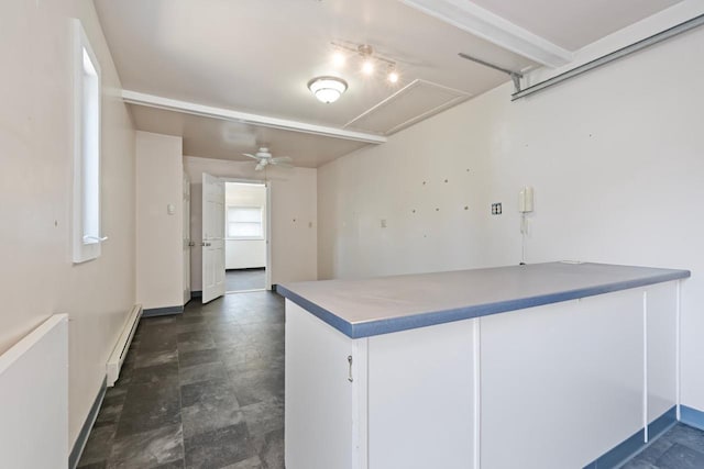 kitchen featuring ceiling fan and baseboard heating