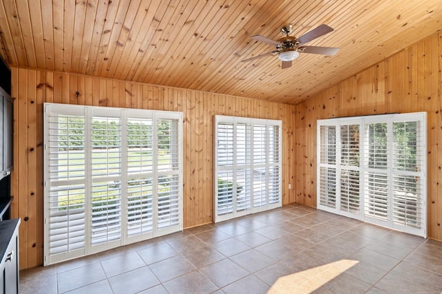 interior space featuring lofted ceiling, light tile patterned floors, wood ceiling, and ceiling fan