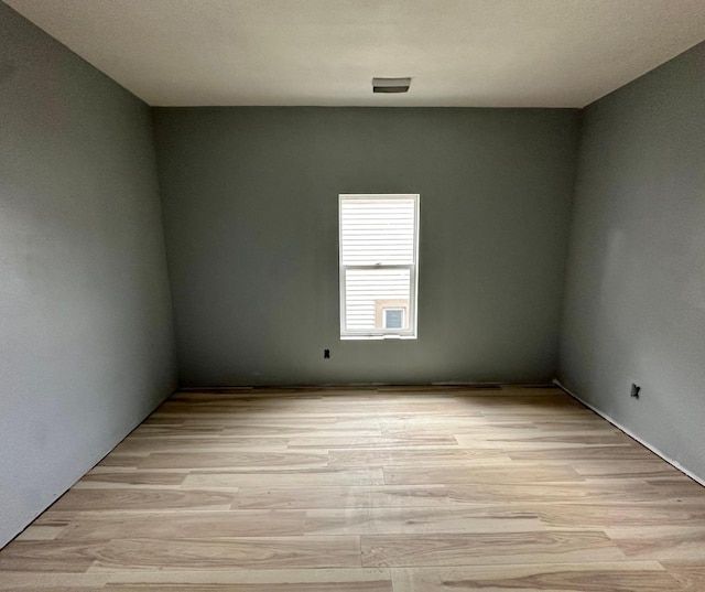 unfurnished room featuring light wood-type flooring