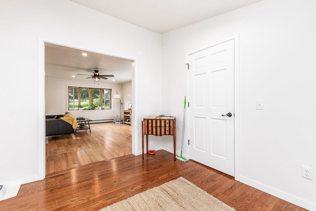 foyer with hardwood / wood-style floors and ceiling fan