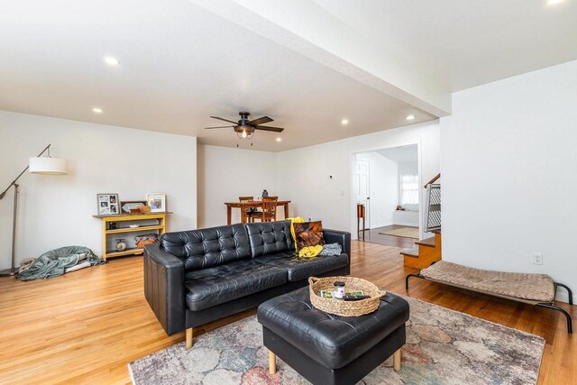 living room with ceiling fan and hardwood / wood-style floors