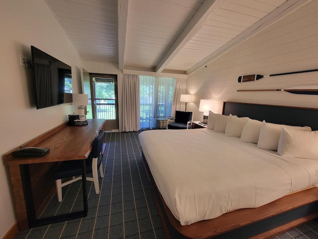 bedroom featuring vaulted ceiling with beams