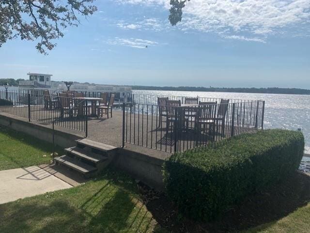 wooden deck featuring a water view