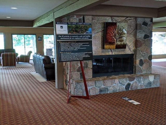 interior details featuring carpet and a fireplace