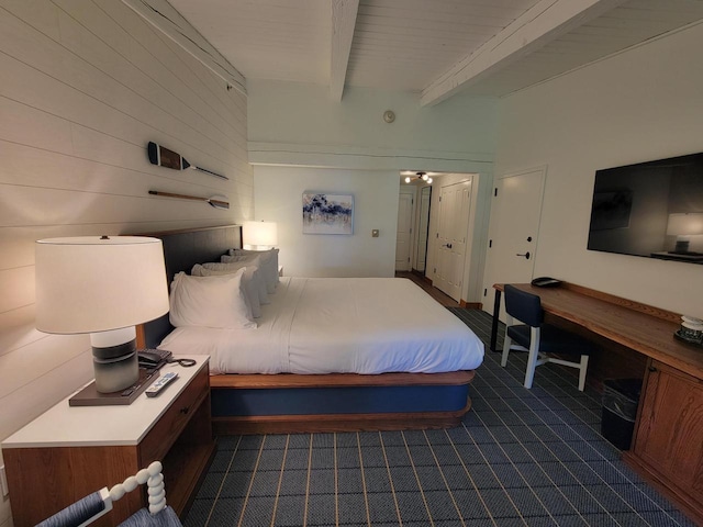 bedroom featuring beam ceiling and wood ceiling