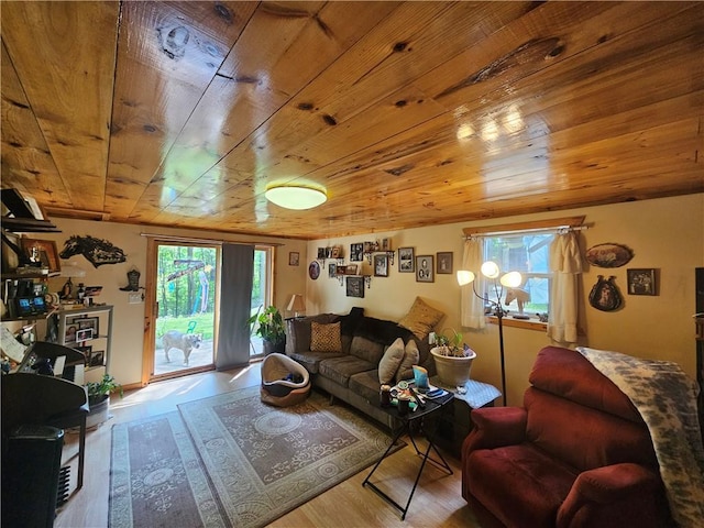 living room with wood ceiling, plenty of natural light, and light hardwood / wood-style floors