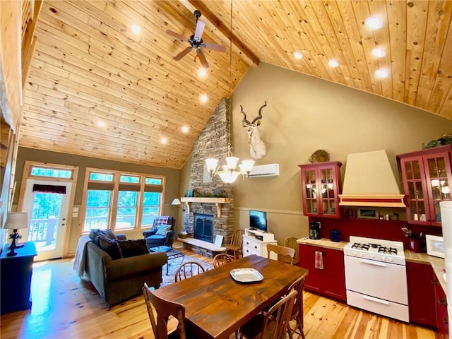 dining space featuring high vaulted ceiling, wooden ceiling, beamed ceiling, a fireplace, and light hardwood / wood-style floors