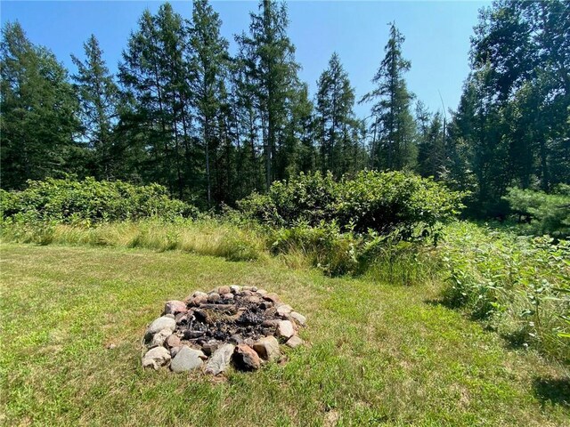 view of yard with an outdoor fire pit