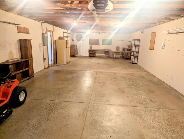 garage featuring a garage door opener, electric panel, and white fridge