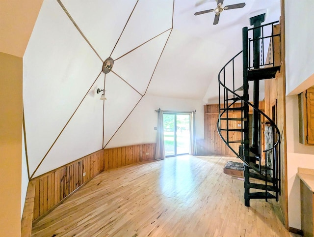 additional living space with vaulted ceiling, ceiling fan, and light wood-type flooring