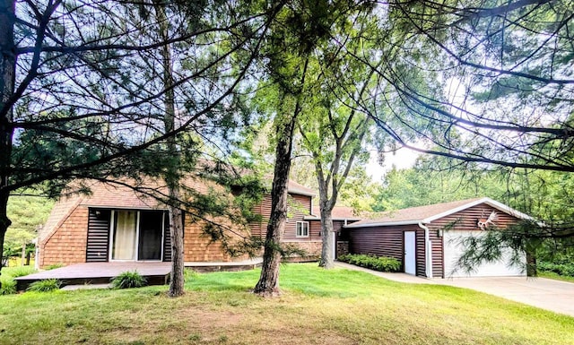 view of front of home featuring a garage and a front lawn