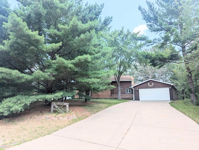 view of front of home with a garage, an outdoor structure, and a front lawn