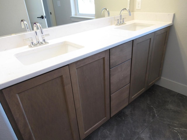 1790 Arbor Vista Pl, West Bend, WI 53095 - bathroom featuring double vanity and baseboards