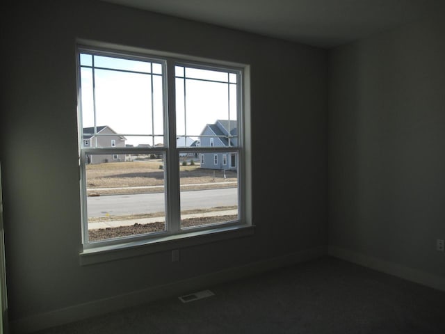1790 Arbor Vista Pl, West Bend, WI 53095 - carpeted empty room featuring healthy amount of natural light and baseboards