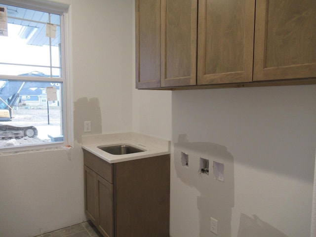 1790 Arbor Vista Pl, West Bend, WI 53095 - laundry room with healthy amount of natural light, washer hookup, and cabinet space