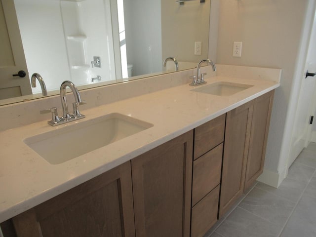 1790 Arbor Vista Pl, West Bend, WI 53095 - full bathroom with tile patterned floors, double vanity, and toilet