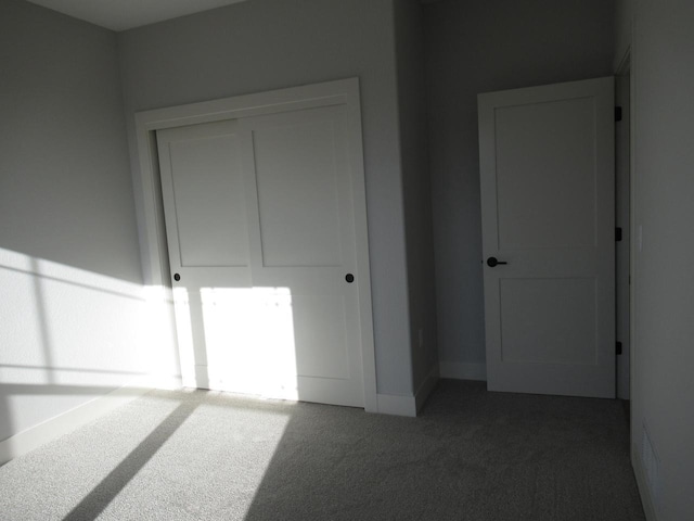 1790 Arbor Vista Pl, West Bend, WI 53095 - unfurnished bedroom with carpet, a closet, and baseboards
