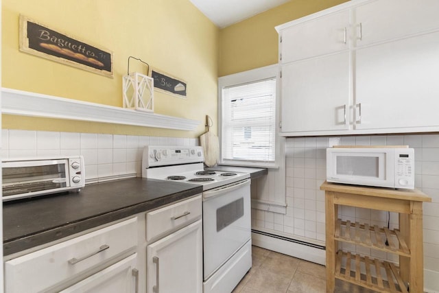 kitchen featuring white cabinetry, light tile patterned floors, white appliances, and baseboard heating