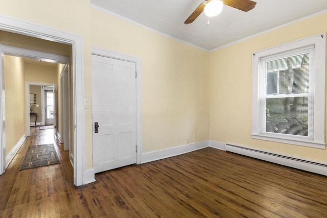 empty room featuring plenty of natural light and dark hardwood / wood-style flooring