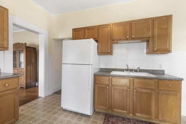 kitchen with white fridge and sink