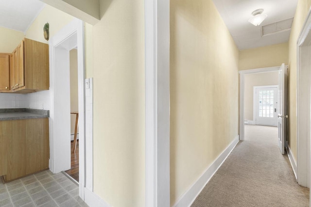 corridor with baseboard heating