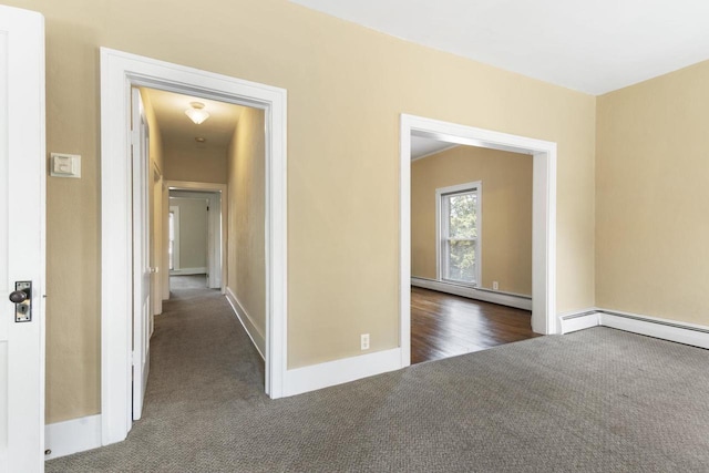 interior space with a baseboard radiator and dark carpet