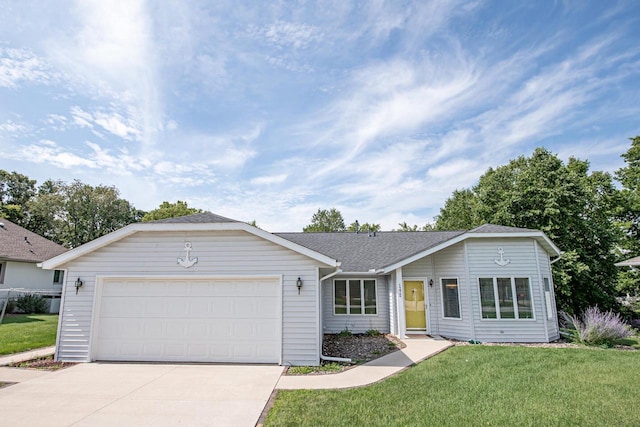 ranch-style home featuring a garage and a front yard