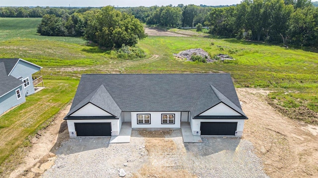 birds eye view of property featuring a rural view