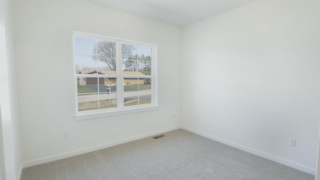 716 Kelsey Rd, Beloit, WI 53511 - carpeted empty room featuring visible vents and baseboards