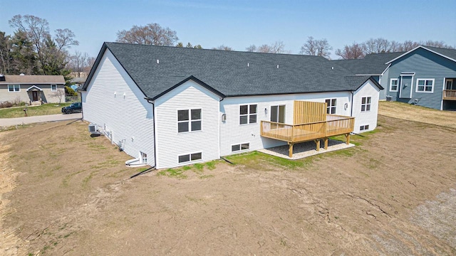 716 Kelsey Rd, Beloit, WI 53511 - back of property with a lawn, a deck, and roof with shingles