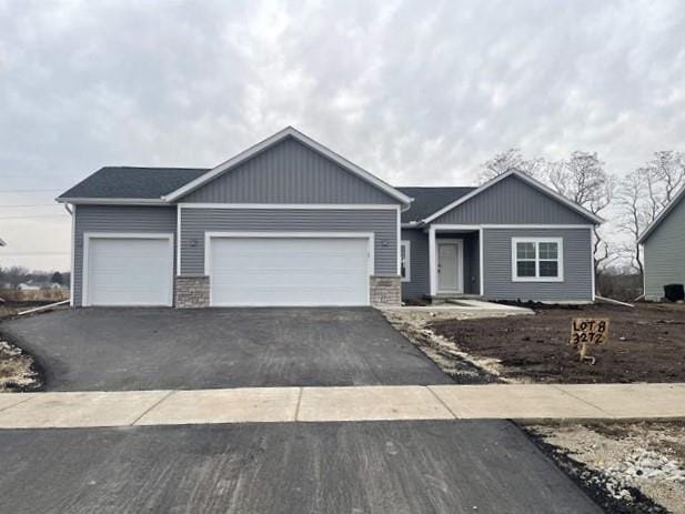 view of front of home featuring driveway and an attached garage