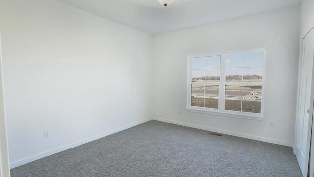 3272 S Bartells Dr, Beloit, WI 53511 - unfurnished room with carpet flooring, baseboards, and visible vents