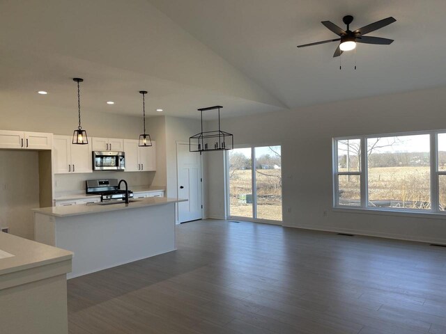3272 S Bartells Dr, Beloit, WI 53511 - kitchen with white cabinetry, light countertops, plenty of natural light, and stainless steel appliances