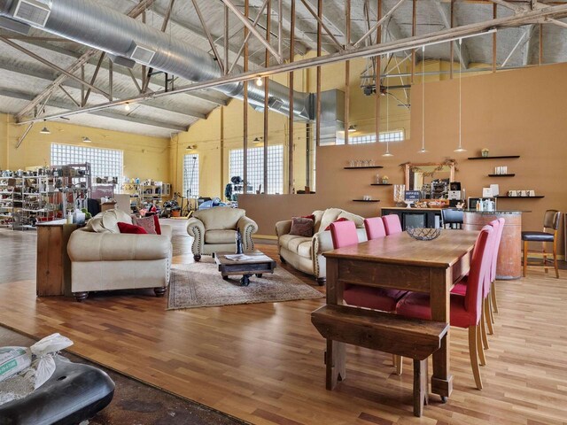834 N Water St, Sheboygan, WI 53081 - dining room featuring wood-type flooring and high vaulted ceiling